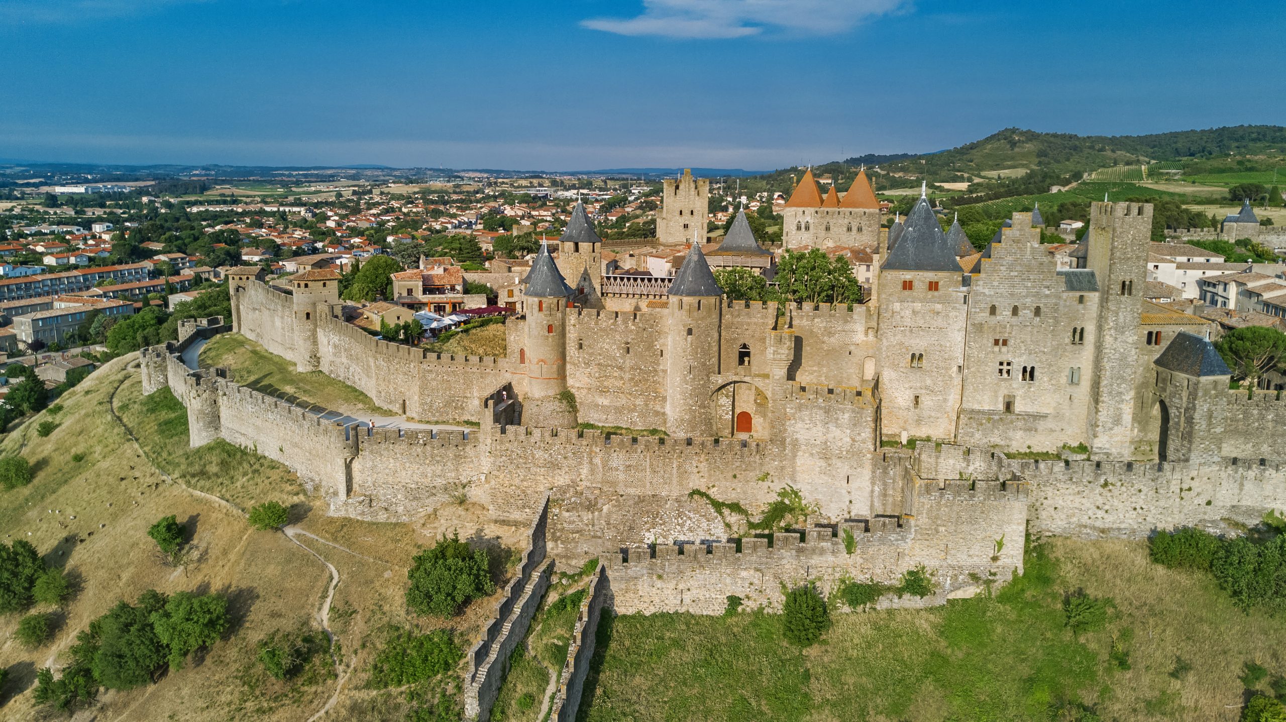 Aerial top view of Carcassonne medieval city and fortress castle from above, Sourthern France