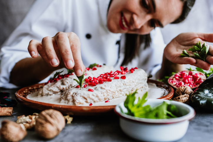 mexican woman chef cooking chiles en nogada recipe with Poblano chili and ingredients, traditional dish in Puebla Mexico