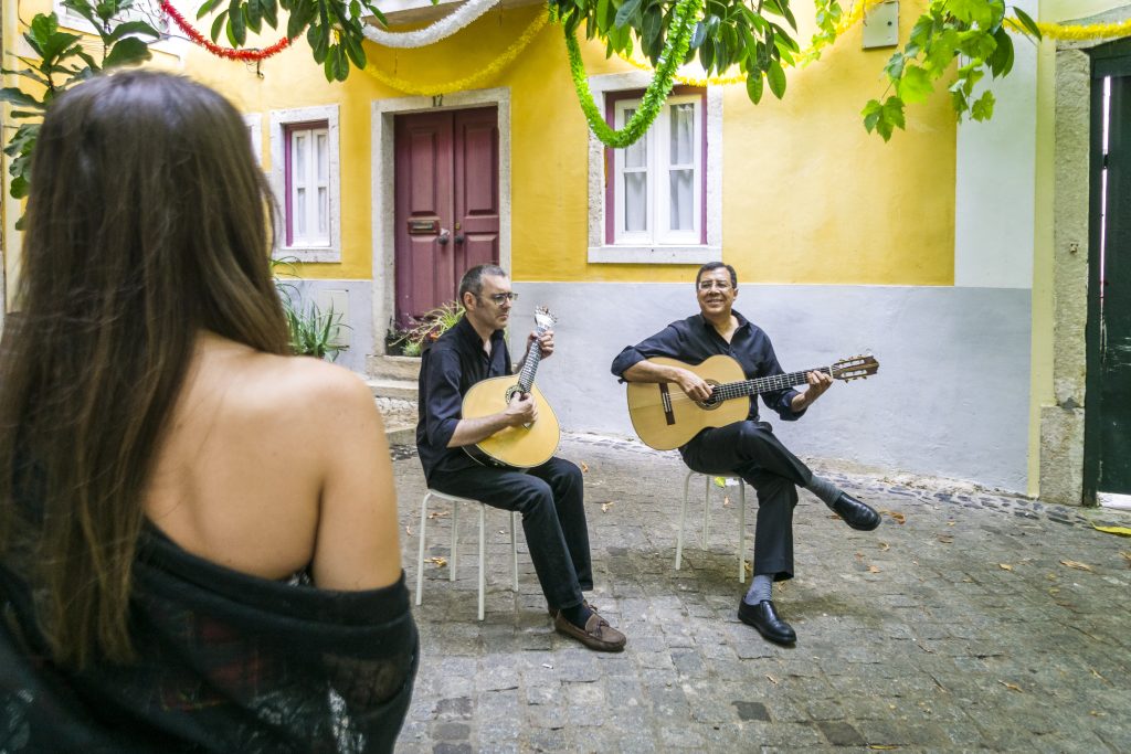 Fado band performing traditional portuguese music in the courtyard of Alfama, Lisbon, Portugal