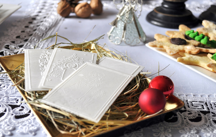 Polish traditional Christmas wafer on hay.