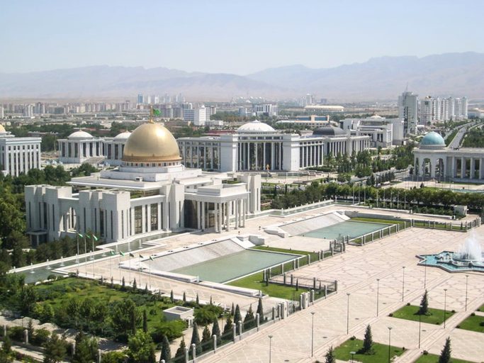 Ashgabat. Standing on the Arch of Neutrality I had this beautiful view over the Ruhyyet Palace. After becoming independent of the Sovjet Union this immense marble building with domes and collums was created, meant to be a significant cultural, political and social venue in the new and independent social and political life of Turkmenistan.